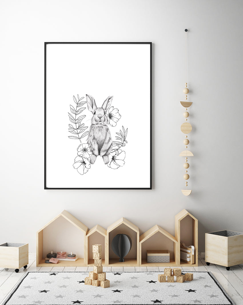 Bunny in sitting position, surrounded by pretty florals and leaves drawn in line art