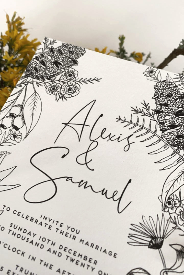 Modern hand drawn Australian botanicals on wedding invites all in black and white